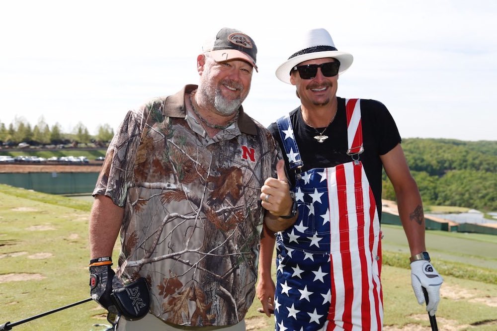 Larry the Cable Guy and Kid Rock stop for a photo amid play at Big Cedar Lodge.